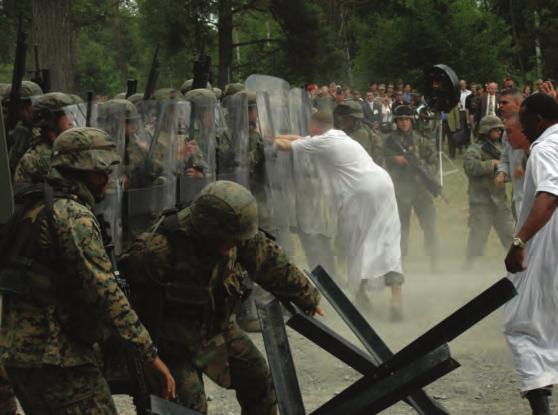 U.S. Marines and Soldiers demonstrate the use of NLWs and tactics during an exercise sponsored by the U.S. European Command and hosted by U.S. Marine Corps Forces, Europe, in Boeblingen, Germany, June 21, 2006.