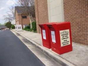 In Perry, the donation boxes are red and located at the rear of the building. For pickup of large donations, call any library and leave a request.