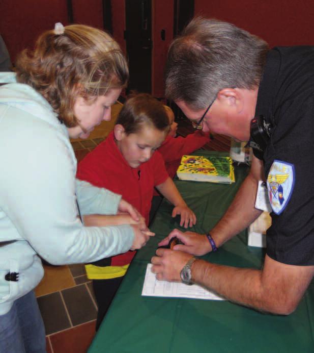 Almost 700 events were offered and reported attendees and participants exceeded 12,000. 1 Saukville police provide Child Identity Kits at the Kick Off event.