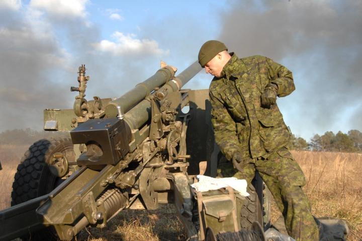 Canadian Army Corporal Chad Acker from 1st Field Artillery Regiment fires a C3 105mm howitzer Feb. 16, 2009.