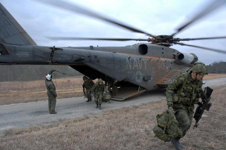 Canadian Soldiers of the 36 Canadian Brigade Group Headquarters unload from a U.S. Navy MH-53E Sea Dragon during Exercise Southbound Trooper IX at Fort Pickett, Va.