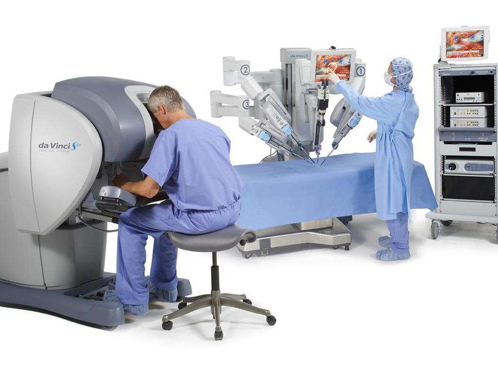 The da Vinci Surgical System Surgeon Console Patient-side cart
