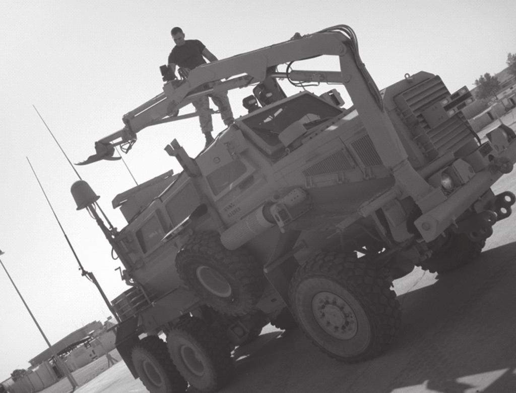 An MWSS Marine inspects the Buffalo Mine-Protected Clearance Vehicle (MPCV). formations, and IED interrogation and identification.