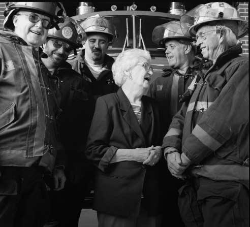 Ruth Shaffer, philanthropist, with members of the Philippi Volunteer Fire Department. Mrs.
