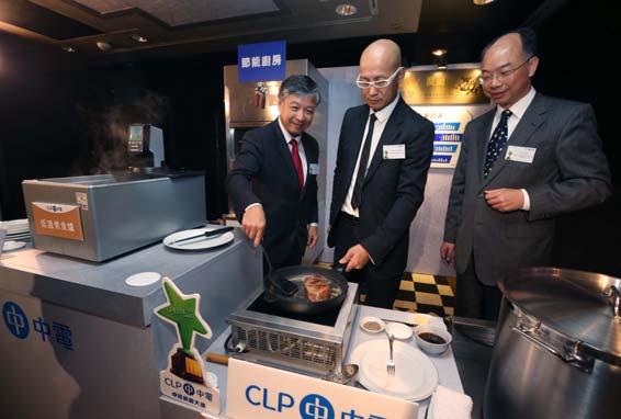 (Photo 5) (Photo 5) Mr Paul Poon, Managing Director Designate of CLP Power Hong Kong (left), and Mr Frank Chan, JP, Director of Electrical and Mechanical Services (right), teamed up with renowned