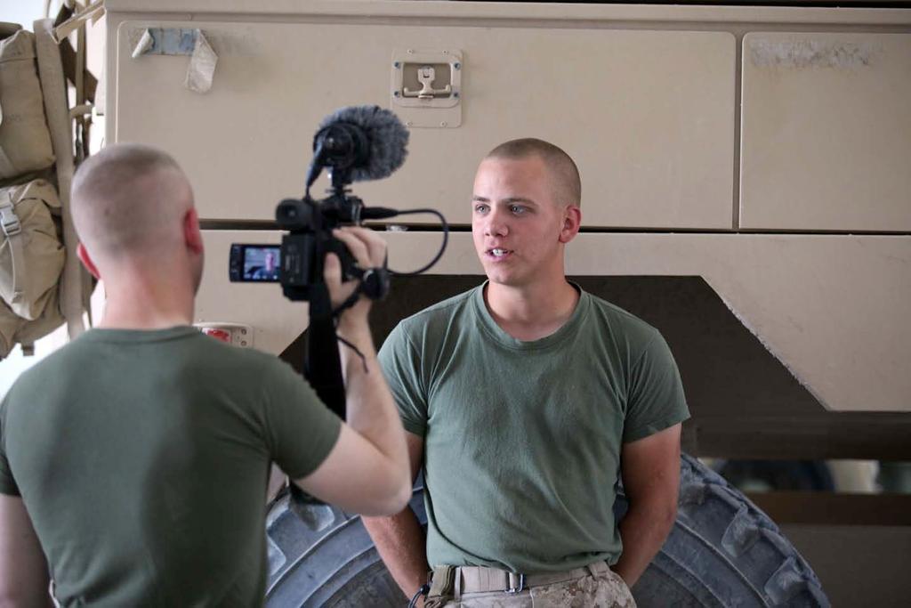 120511-M-KH643-079 U.S. Marine Corps Lance Cpl. Joshua M. Rudy, left, a combat videographer, interviews Lance Cpl.