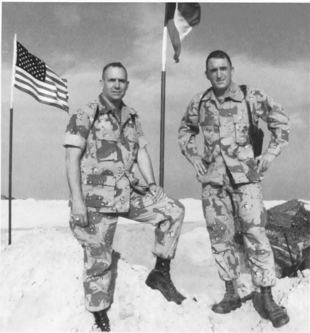 32 U.S. MARINES IN THE PERSIAN GULF, 1990-1991 r. Col John A. Woodhead Ill, Chief of Staff 2d Force Service Support Group, left, and BGen Charles C.