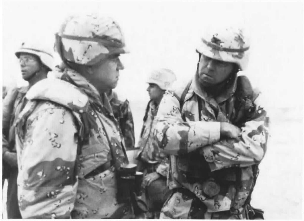 34 U.S. MARINES IN THE PERSIAN GULF, 1990-1991 I MajGen William M. Keys, left, commanding general of the 2d Marine Division, confers with Col John B. Sylvester, U.S. Army, commander of 1st Brigade, 2d Armored Division.
