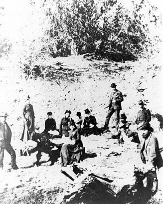 Officers and wives on a picnic near Ft. Apache, Arizona, on 30 December 1883. Left to right: (Standing) 1st Lt. Charles B.