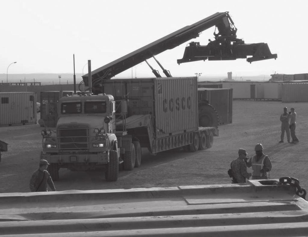 The FSC distribution platoon loads construction materials for base support missions throughout Iraq. the next seven to ten days.