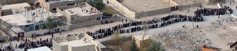46 A Global Controversy: The U.S. Invasion of Iraq Iraqis line up to vote during the 2005 elections. U.S. Marine Corps.