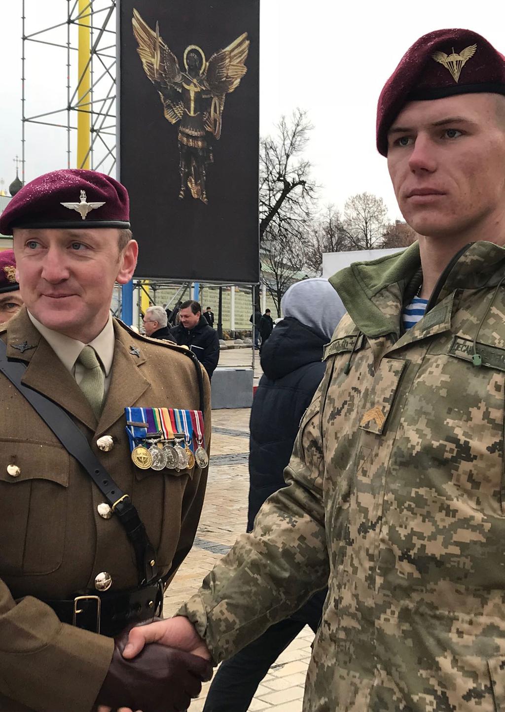 A British officer (left) and a Ukrainian paratrooper attend a special ceremony in Ukraine, 21 November 2017.