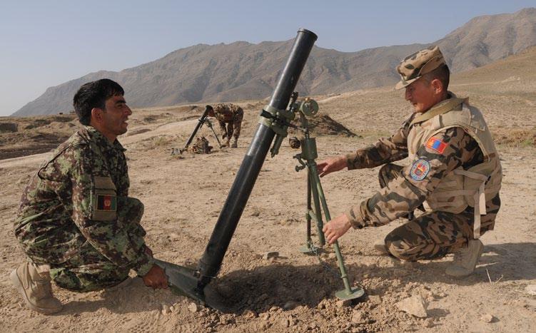 LIVE-FIRE TRAINING Mongolians help Afghan National Army refine weapon skills An Afghan National Army Soldier and a Mongolian Mobile Training Team (MTT) member emplace an 82 mm mortar system prior to