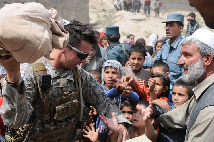 HELPING THE NEEDY Humanitarian aid provided to some of Kabul s poorest Story and photos by Capt. Anthony Deiss Task Force Rushmore Public Affairs KABUL Afghan National Police (ANP) and U.S. Army Soldiers provided humanitarian aid to children of the Shohadayi Salehin village Sept.