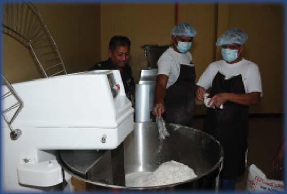 Inmates preparing dough at the bakery Fresh bread and buns from the oven Impar ng Marketable Skills to Inmates To ensure that inmates are equipped