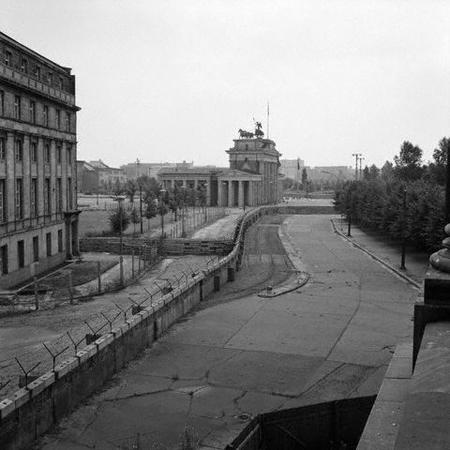 The Berlin Wall shortly after its construction Source B In 1963, President Kennedy visited West Berlin and made his famous 'I am a Berliner' speech next to the Berlin Wall: There are many people in