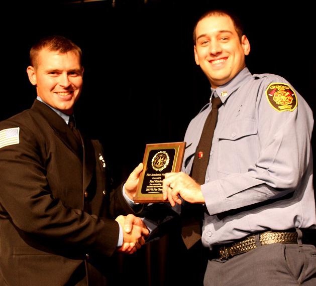 Ethan Garner presents the Fire Academic Award to Paul Ribeiro. LEFT - Sgt.