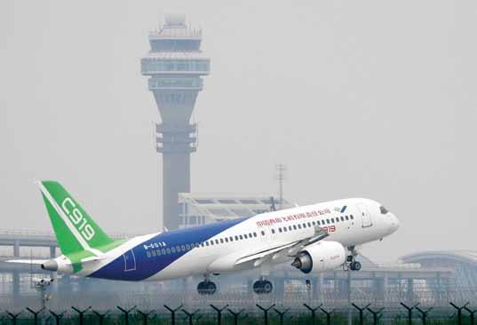 China s Civil Challenge C919 passenger jet taking off at Pudong International Airport in Shanghai The Comac C919 is airborne China s first indigenous designed and built passenger jetliner the C919