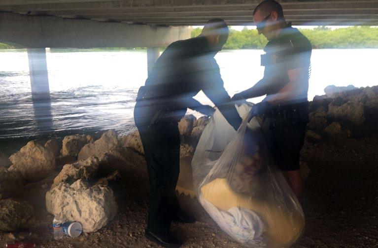 Members of Sgt. Nick Whiteman s squad cleaning up underneath the Vaca Cut Bridge in Marathon.