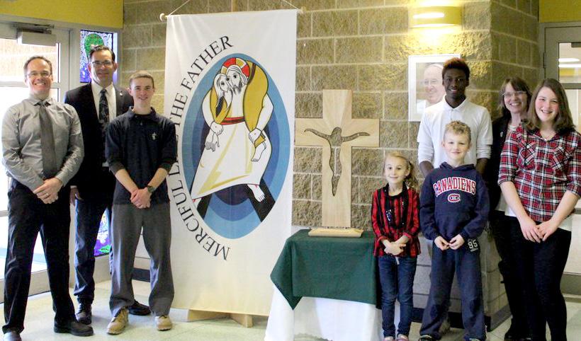 Holy Trinity Catholic Secondary School in Courtice began its week with the Cross with readings over the PA system about the Corporal Works of Mercy and prayer.