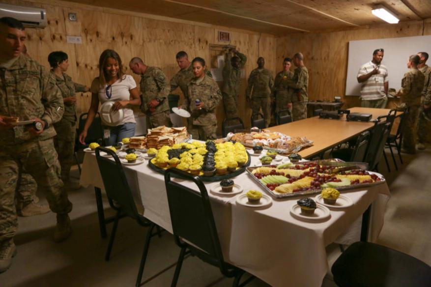 U.S. Army Soldiers and Department of Defense civilians have refreshments during a promotion ceremony at Forward Operating Base Gamberi, Laghman