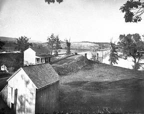 At right, the pontoon bridge across the Potomac and ruins of the stone bridge at Berlin, Maryland (present day Brunswick).