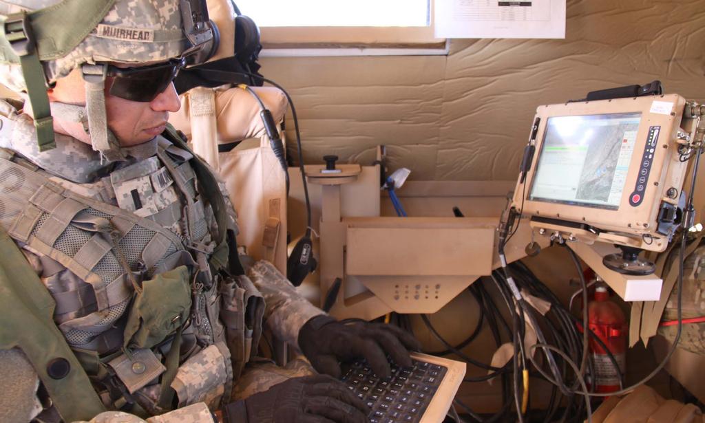 A 2nd Brigade, 1st Armored Division Soldier uses the new chat feature of the Joint Capabilities Release of Force XXI Battle Command Brigade and Below/Blue Force Tracking during NIE 12.1 in November.