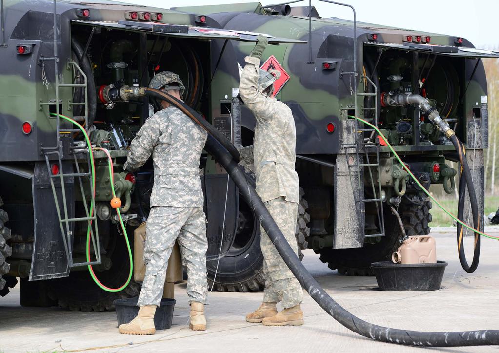 U.S. Army Europe Soldiers with the Distribution Platoon, Echo Company, 3rd Battalion, 159th Aviation Regiment, 12th Combat Aviation Brigade prepare for refueling operations with an M978 tank fuel