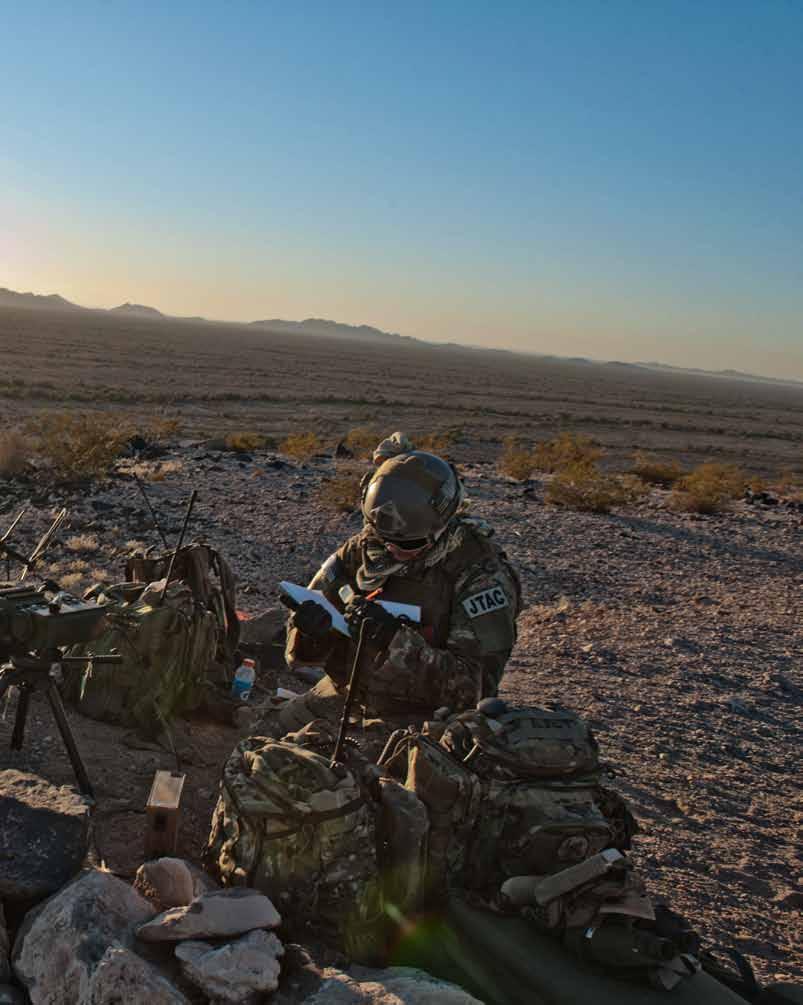 Below: Lt. Col. Timothy Donnellan and Tech. Sgt. Nate Durfee, from the 124th Air Support Operations Squadron, prepare for a close air support mission at Barry M. Goldwater Air Force Range, Ariz.
