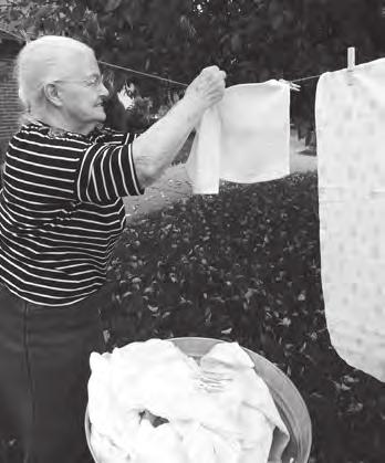 Margaret Hisel enjoys hanging laundry during Old-Time Photo day. The Terrace Nursing and Rehabilitation Facility, Berea Residents, family and staff enjoyed a week of celebrating their Life s Stories.