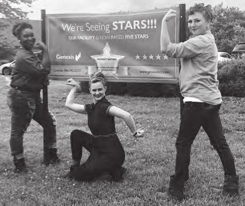Sequoia Chase, CNA/Activities Director Assistant; Kayla Smith, CNA/Activities Director Assistant; and Jessica LaMarr, CNA/HR/Payroll, strike their Rosie the Riveter poses.