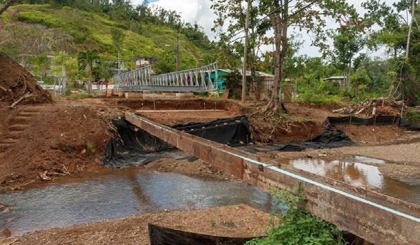 Water pipes and bridge foundations are constructed to replace a hurricanedamaged bridge in Mayaguez.