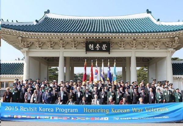 On their first morning in Korea the veterans and their escorts paid respects at the National Cemetery of Korea in Seoul, and are shown here in their departure photograph, before proceeding to the War