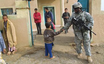 SSG Keshon Henry platoon sergeant for the Security Detachment, 3rd Division Special Troops Battalion (3rd DSTB) says goodbye after a site assessment of a U.S.-funded school built at a village near Contingency Operating Base (COB) Speicher, Iraq.