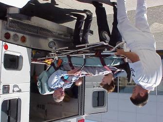 the weight of both the gurney and the patient while pushing the gurney into the ambulance.