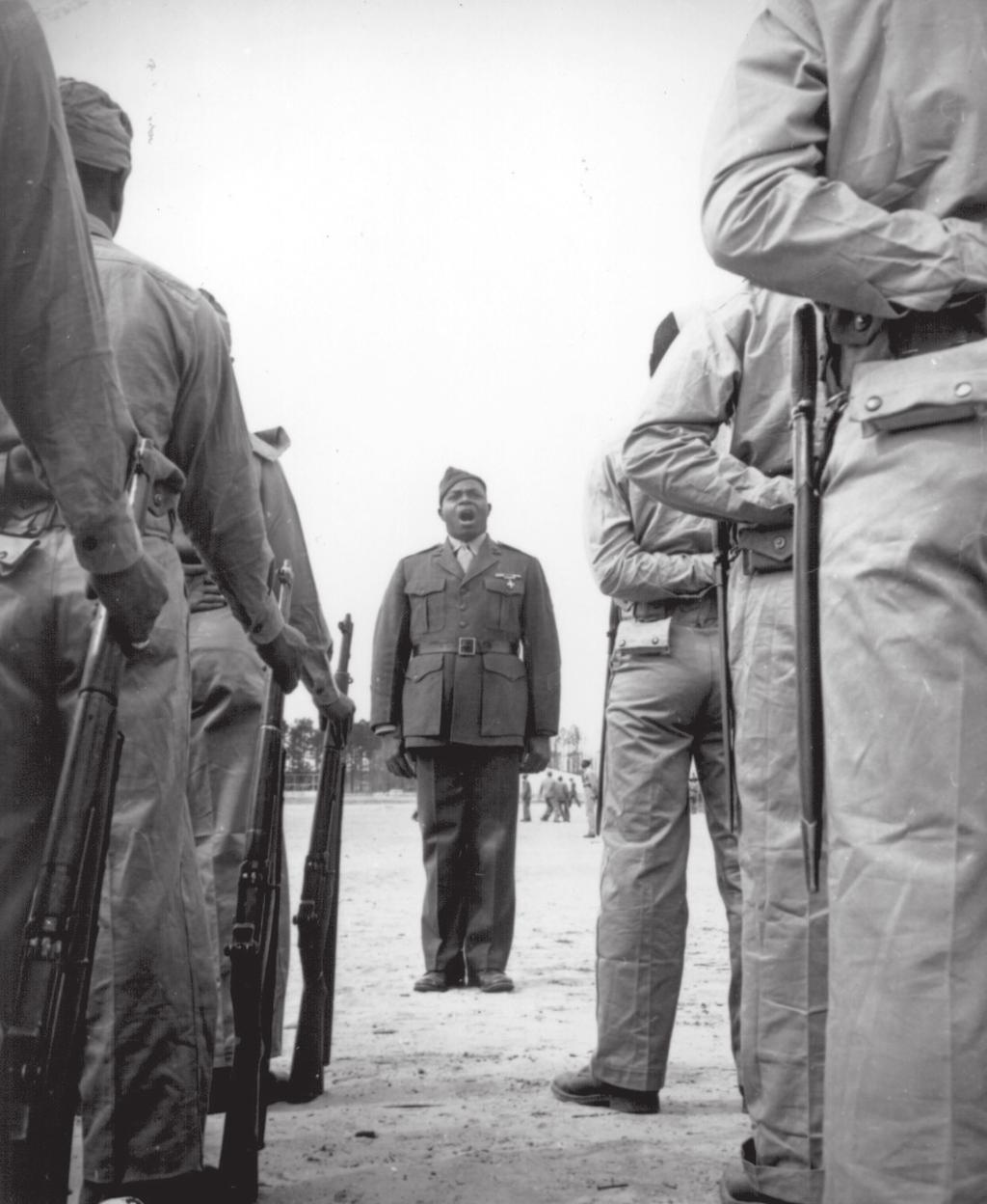Photograph, A platoon of African-American Marines listening to their drill instructor, Sergeant Gilbert