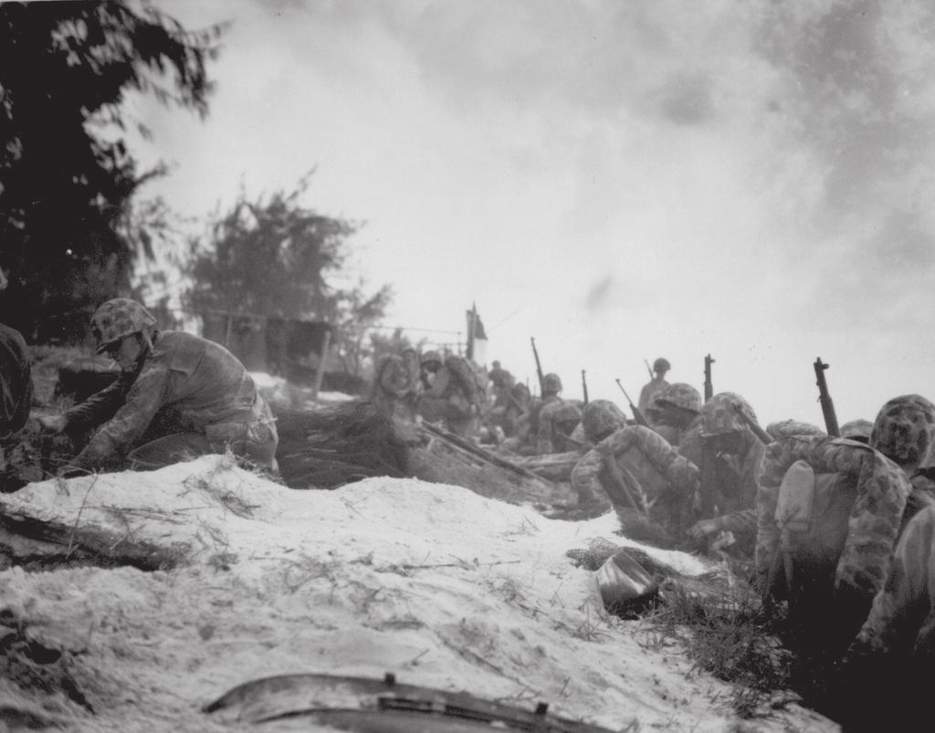 Photograph, African American Marines awaiting orders on the beaches of Saipan