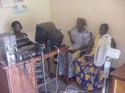 Women farmers recording their concerns at the Kubere Information Centre (KIC) mini
