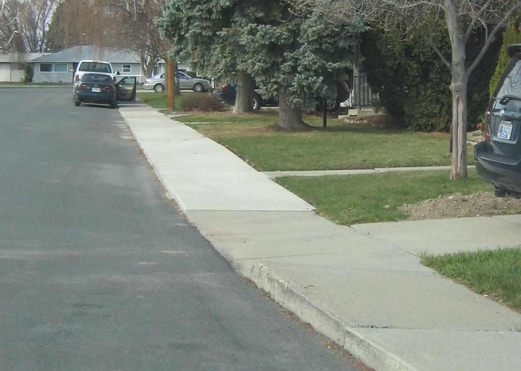 New Construction Replacement or repair of a driveway apron is not included in grant as it is not considered part of the sidewalk.