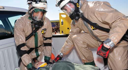 Isadore Gurnell and Senior Airman Cody Eslick perform a Rapid Trauma Assessmen on Tech. Sg.