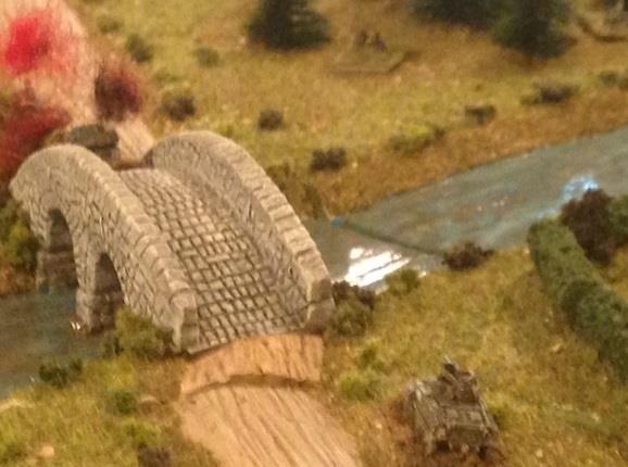 The Scott s luck failed as it slowed at the other end of the bridge to navigate the two burning AFV s.