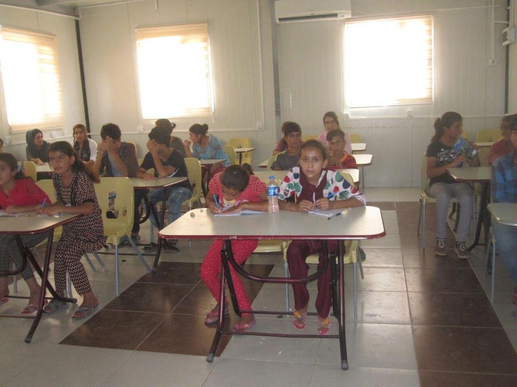 Students attend their English language classes in preparation for the new school year, August 2017 6.