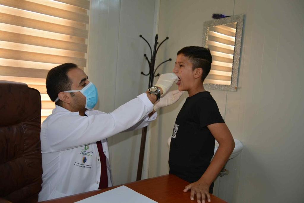 A child receives a check-up by a