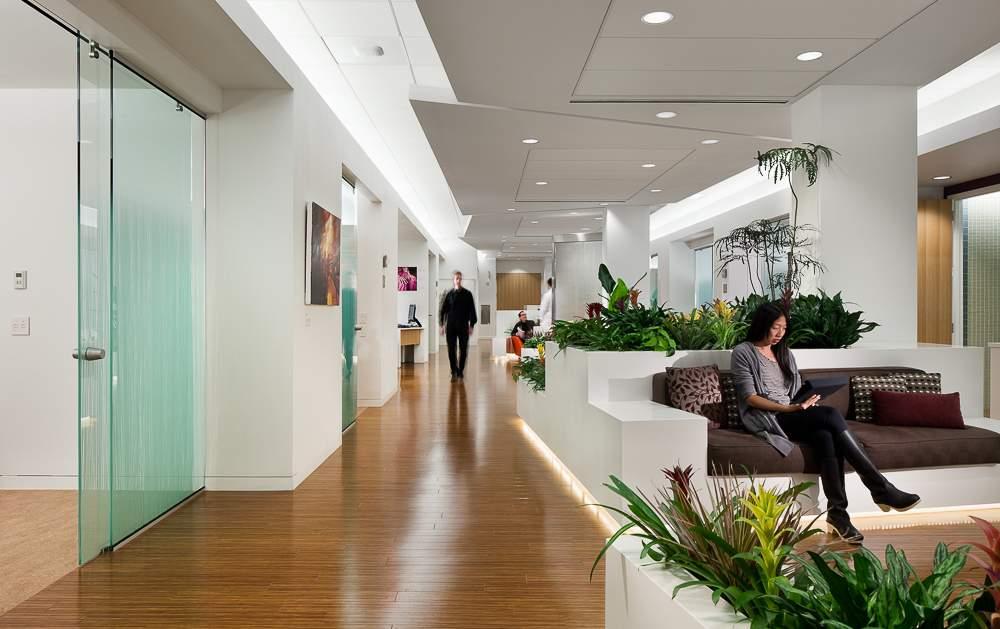 This central space is open and accessible to the treatment rooms that look out onto it from the patients chair. The infusion rooms, or pods, were designed to accommodate patient choice.