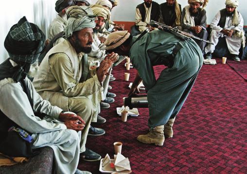 Members of Charlie Company talk with tribal elders in Paktika.
