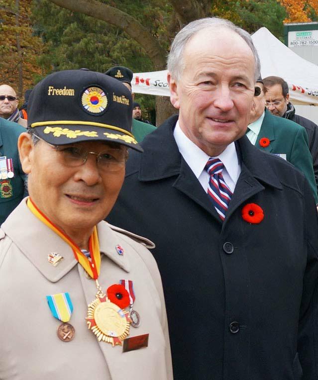 Page 4 of 7 Freedom is Not Free, the message reads on the cap of Major Charles Kim of Toronto.