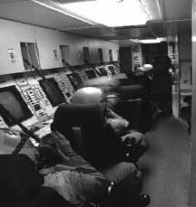 The flight crew proceeds through the checklists, and battle staff members take their stations in the capsule.