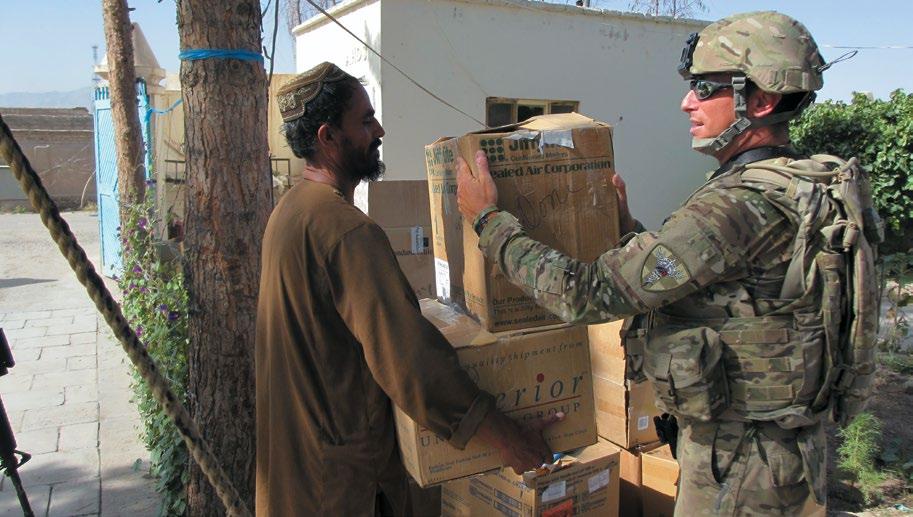Personnel from the Tarin Kowt Forward Surgical Element delivering donated medical supplies to Tarin Kowt Provincial Hospital. (Maj. Tucker A.