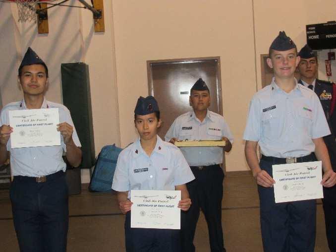 Tourtel and Cadet Airmen Han-en H. Cheng and Jacob Hensley receive their certificates for their first orientation flight in a powered CAP aircraft. (Photos: Lt. Col. Jay T.