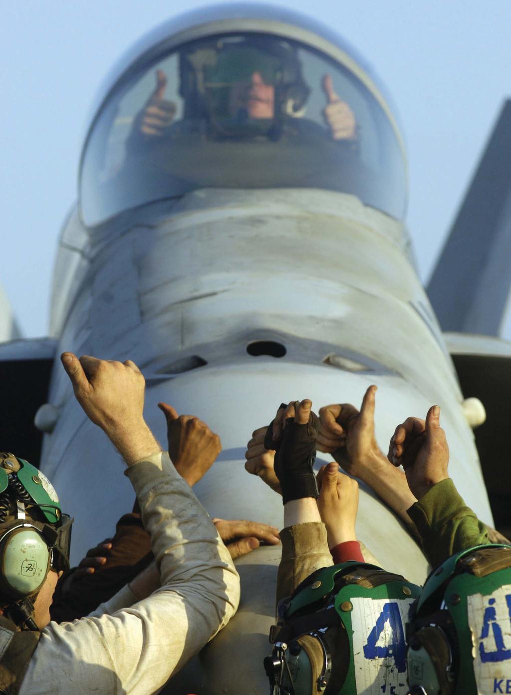 VFA-86 flight deck personnel echo the pilot s thumbs-up during flight operations aboard Enterprise (CVN 65) in